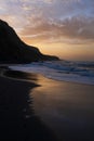 Beautiful beach shore landscape at sunset time with dusk and down evening - beach in the dark and colorful sky in background