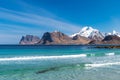 Mountain chain with snow in the background. From Myrland beach in Lofoten - Norway. Royalty Free Stock Photo