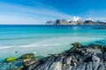 Beautiful beach during springtime on a sunny day with blue sky and silent ocean with small waves. From Myrland beach in Lofoten