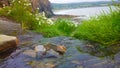 Beautiful Beach Summer Time View Hilltop Grass Water waterfall rocks sea green cliff side photo