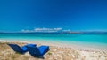 Beautiful beach. Sunbeds with umbrella on the sandy beach near the sea. Royalty Free Stock Photo