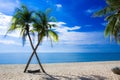Beautiful beach in Thailand. View of sunlight tropical sea beach with coconuts palms. Tropical sand beach holiday for background Royalty Free Stock Photo