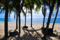 Beautiful beach in Thailand. View of sunlight tropical sea beach with coconuts palms. Tropical sand beach holiday for background Royalty Free Stock Photo