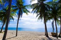 Beautiful beach in Thailand. View of sunlight tropical sea beach with coconuts palms. Tropical sand beach holiday for background Royalty Free Stock Photo