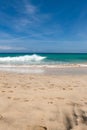 A beautiful beach with turquoise water and a blue sky Royalty Free Stock Photo