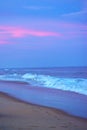 Beautiful beach view over the sunset colorful sky. Moving elements and wave photography from the beach in india. Dark blue sky in