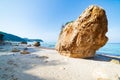 Beautiful beach and water bay in the greek spectacular coast line. Turquoise blue transparent water, unique boulders, Greece