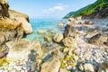 Beautiful beach and water bay in the greek spectacular coast line. Turquoise blue transparent water, unique boulders, Greece