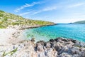 Beautiful beach and water bay in the greek spectacular coast line. Turquoise blue transparent water, unique rocky cliffs, Greece