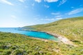 Beautiful beach and water bay in the greek spectacular coast line. Turquoise blue transparent water, unique rocky cliffs, Greece