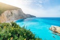 Beautiful beach and water bay in the greek spectacular coast line. Turquoise blue transparent water, unique rocky cliffs, Greece