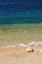 Beautiful beach with wave and big stone Royalty Free Stock Photo