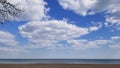 Beautiful beach with white sand, turquoise ocean water and blue sky with clouds in sunny day