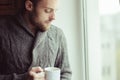 Beautiful bearded man drinking coffee