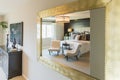 Beautiful Bedroom Reflection in Decorative Mirror. Royalty Free Stock Photo