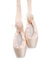 Beautiful beige ballet shoes with cute ribbons on white, top view