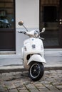 Beautiful beige Piaggio Vespa scooter parked in central Vienna