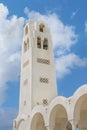 Beautiful belfry of the Cathedral Of Candlemas Of The Lord in the famous touristic Fira town at summer sunny day. Santorini island Royalty Free Stock Photo