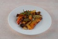 Beautiful bell peppers grilled on a white plate, close-up