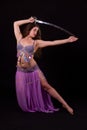 Beautiful bellydancer holding a sword Royalty Free Stock Photo