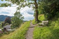 beautiful bench beside footpath up to Weinberg hill, Schliersee tourist resort Royalty Free Stock Photo