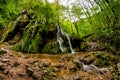 Beautiful Beusnita waterfall in the forest with green moss Royalty Free Stock Photo