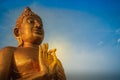 Beautiful big golden Buddha statue on the hilltop at Wat Khao Ba Royalty Free Stock Photo