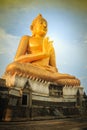 Beautiful big golden Buddha statue on the hilltop at Wat Khao Ba Royalty Free Stock Photo