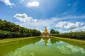 Beautiful Big Golden Buddha statue under blue sky backgroundovince, Thailand