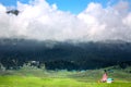 Beautiful Big mountain View,Green grass,Little house,A lot of white clouds Royalty Free Stock Photo