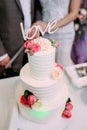 Beautiful multi-tiered wedding cake with the inscription love Royalty Free Stock Photo