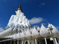 Beautiful Big white Buddha statue against blue sky and clouds in Thailand temple, Wat Phra That Phasornkaew Khao Kho District, Royalty Free Stock Photo