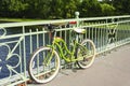 Beautiful bike cruiser parked on the bridge over the river, cycling, outdoor activities Royalty Free Stock Photo