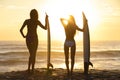 Beautiful Bikini Surfer Women Girls Surfboards Sunset Beach Royalty Free Stock Photo