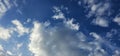 Beautiful billowing clouds (cumulus) in the deep blue sky.