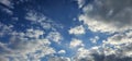 Beautiful billowing clouds (cumulus) in the deep blue sky.