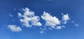 Beautiful billowing clouds (cumulus) in the deep blue sky.