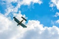 Beautiful biplane in flight on a cloudy sky. Air transport. Sport. Agriculture