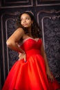 Beautiful, Biracial High School Senior wearing red prom dress Royalty Free Stock Photo