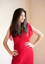 Beautiful biracial teen girl in elegant red dress