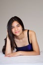 Beautiful biracial teen girl lying down, relaxing