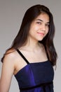 Beautiful biracial teen girl in purple gown