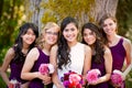 Beautiful biracial young bride smiling with her multiethnic grou