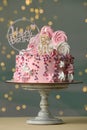 Beautiful birthday cake with festive decor and candle on white table Royalty Free Stock Photo