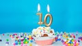 Beautiful birthday greetings to a ten-year-old child on a blue background, card for 10 years happy birthday copy space. Festive Royalty Free Stock Photo