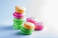 Beautiful biscuits of different colors for tea on a white background