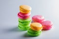 Beautiful biscuits of different colors for tea on a white background