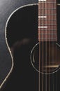 Beautiful black acoustic guitar in flat lay. Professional string instrument in close up Royalty Free Stock Photo