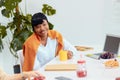 Beautiful black business lady during break time on work place