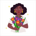 Beautiful black busty woman (girl) holds a bouquet of flowers in her hands.